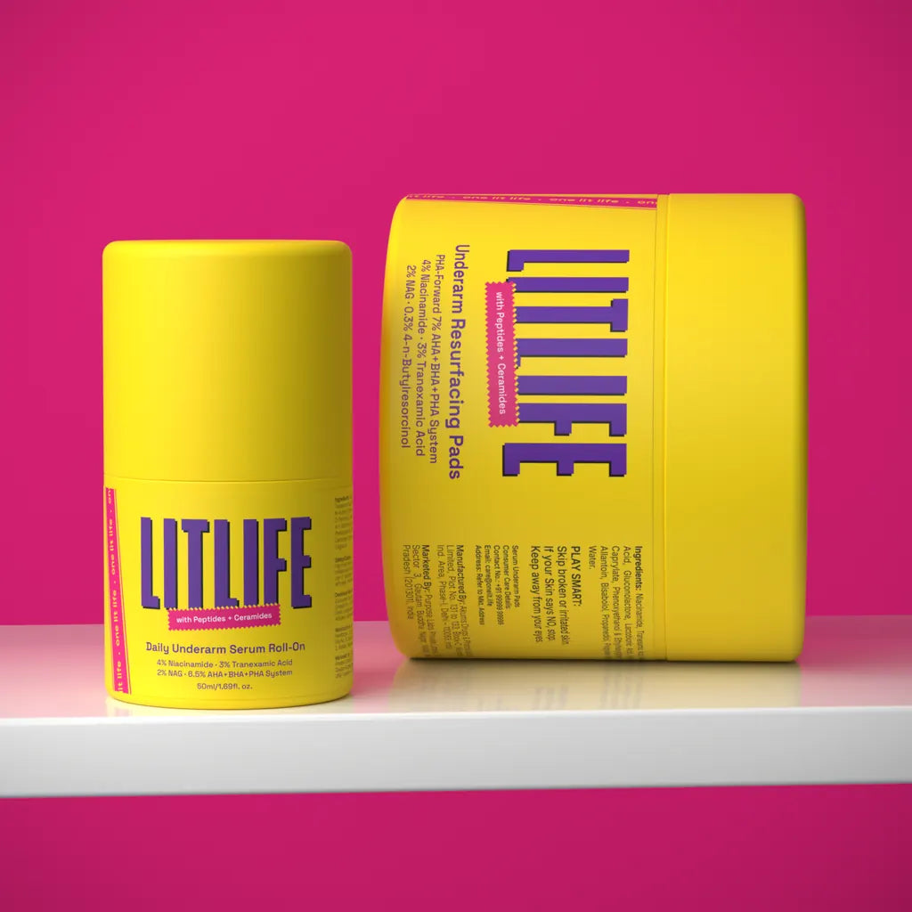 The roll-on standing beside the pads jar on a white shelf against a pink background.